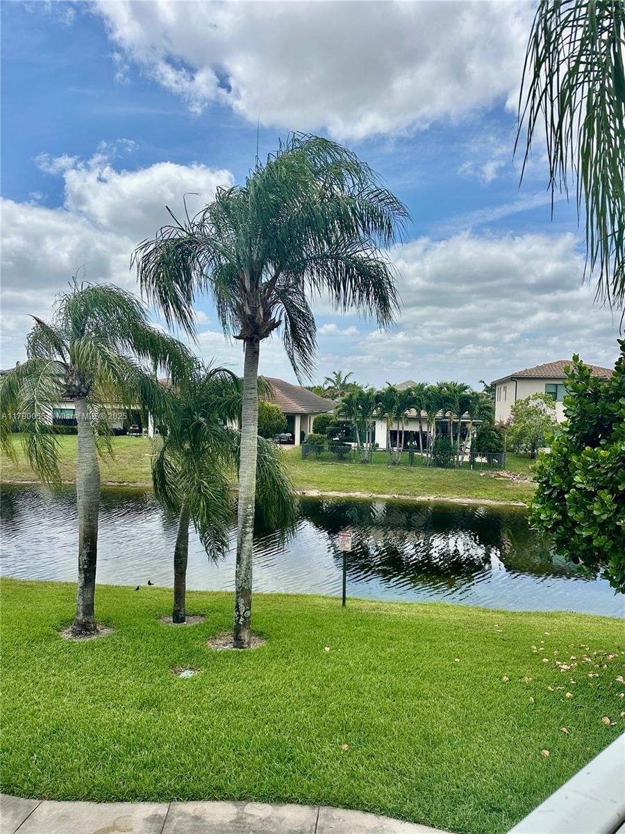1200 Southwest 113th Terrace, Unit 202 Pembroke Pines, FL 33025 - Photo 13 of 14 a view of a lake with a yard