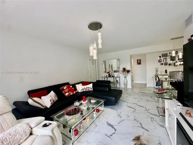 a living room with furniture chess board and a couch