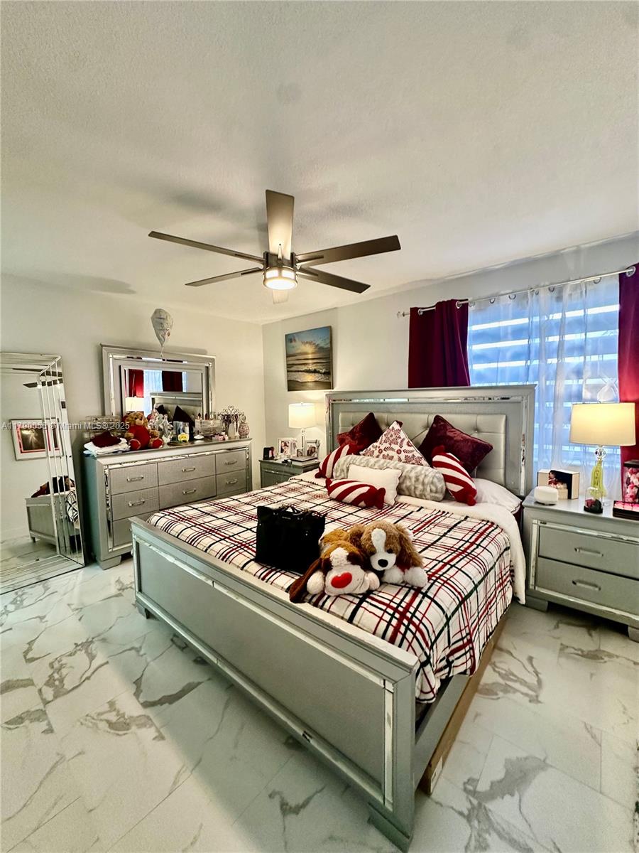 1200 Southwest 113th Terrace, Unit 202 Pembroke Pines, FL 33025 - Photo 7 of 14 a bedroom with bed and window