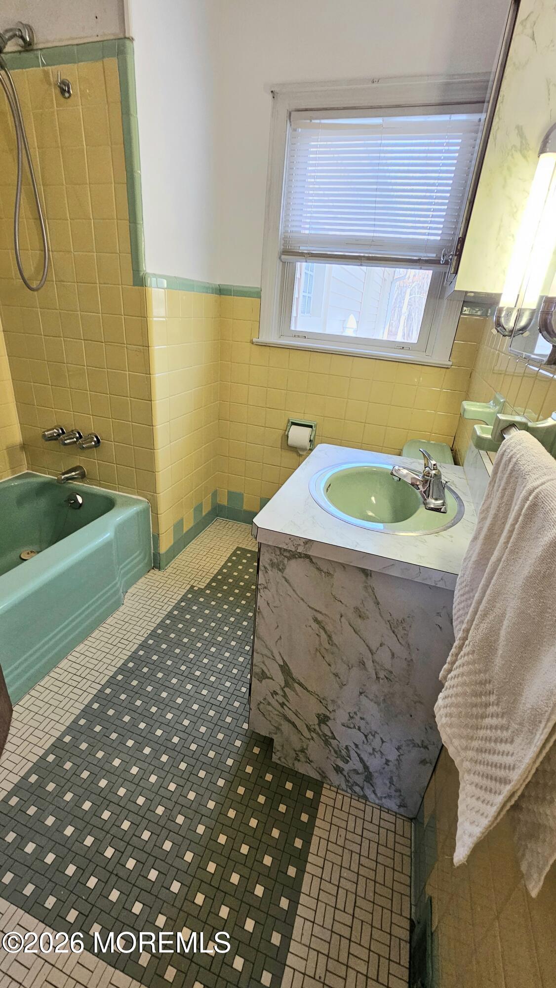 12 Anderson Drive Howell, NJ 07731 - Photo 21 of 26 a bathroom with a sink and a mirror