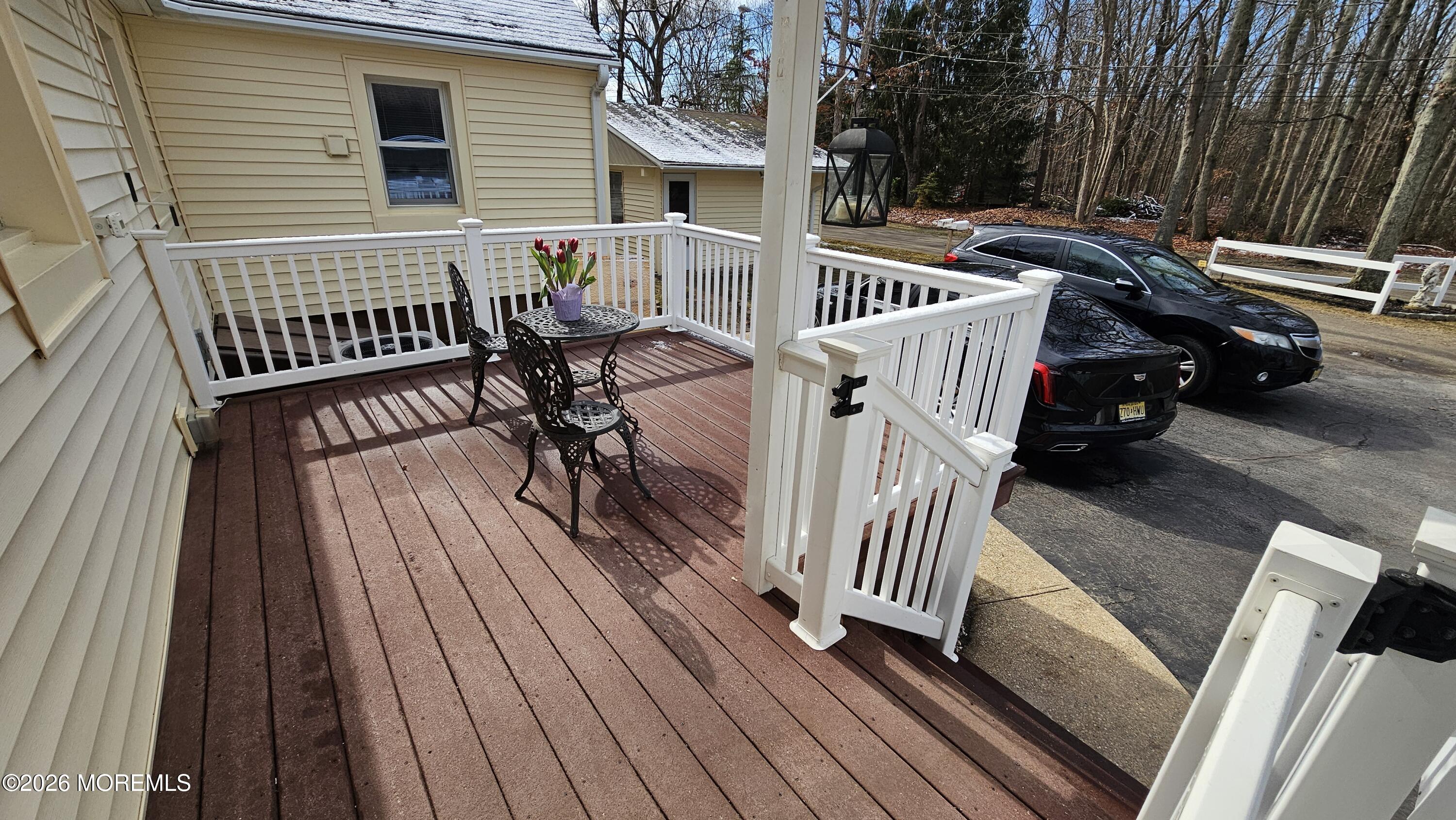 12 Anderson Drive Howell, NJ 07731 - Photo 24 of 26 a view of a roof deck with wooden floor and fence