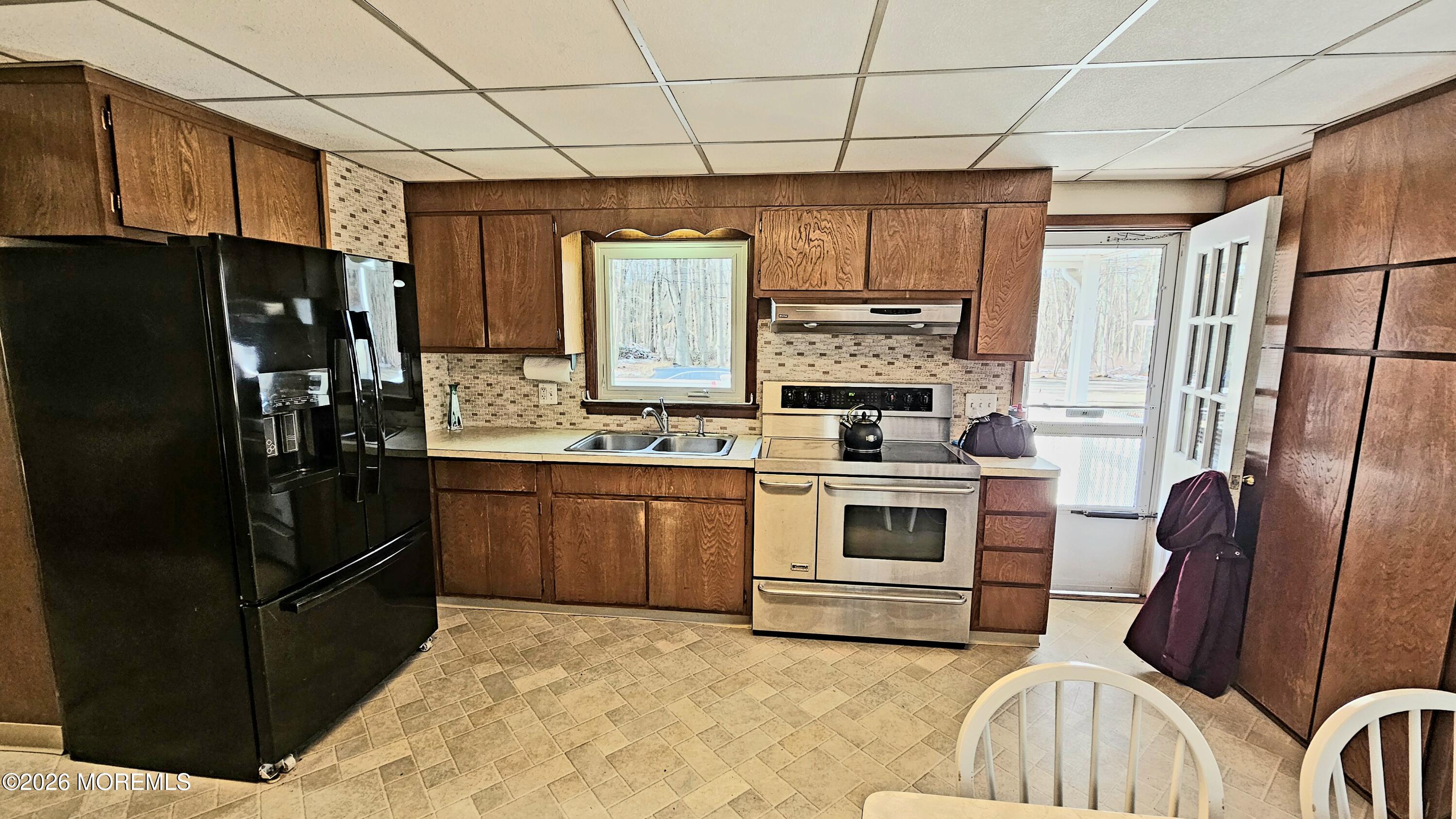 12 Anderson Drive Howell, NJ 07731 - Photo 4 of 26 a kitchen with stainless steel appliances a refrigerator sink and cabinets
