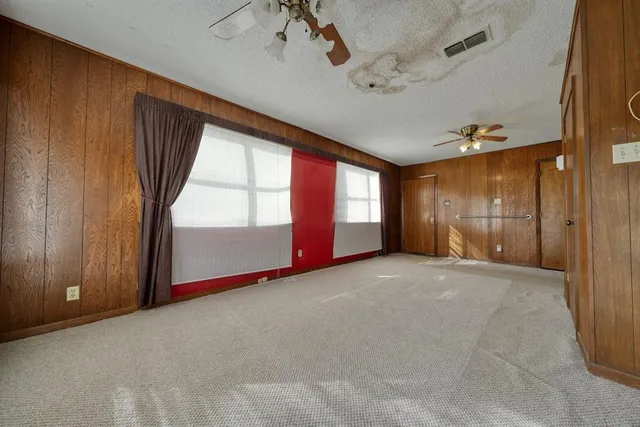 a view of empty room with windows