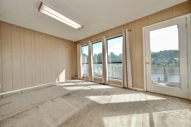 a view of a room with wooden floor and garden