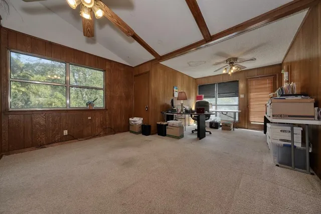 a view of a livingroom with furniture and a window