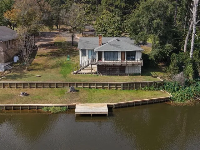 an aerial view of a house with swimming pool