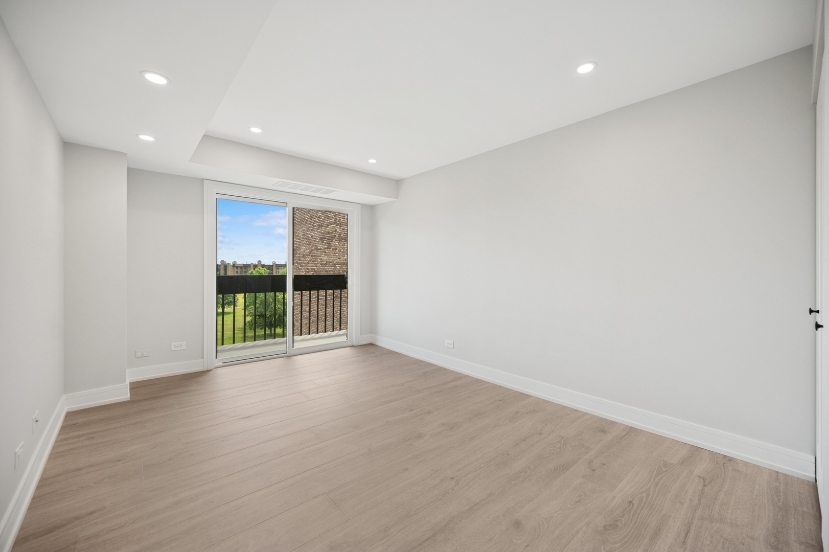 3851 Mission Hills Road, Unit 409 Northbrook, IL 60062 - Photo 13 of 19 wooden floor in an empty room with a window