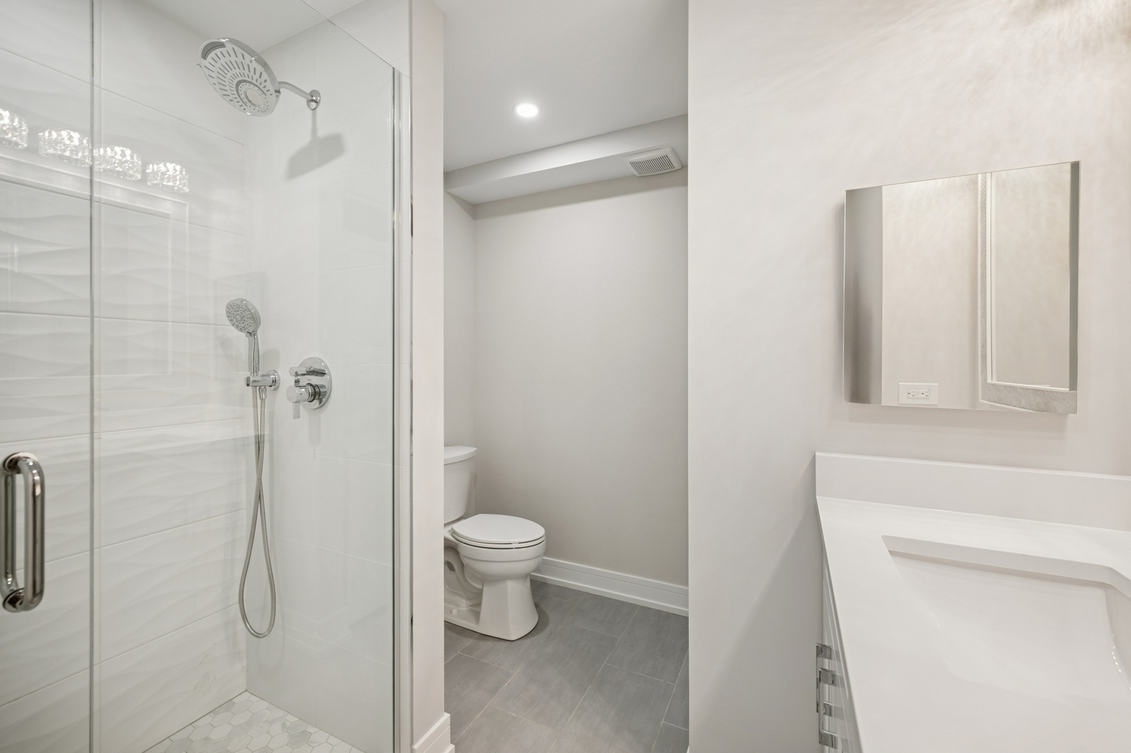 3851 Mission Hills Road, Unit 409 Northbrook, IL 60062 - Photo 14 of 19 a bathroom with a shower a toilet and sink