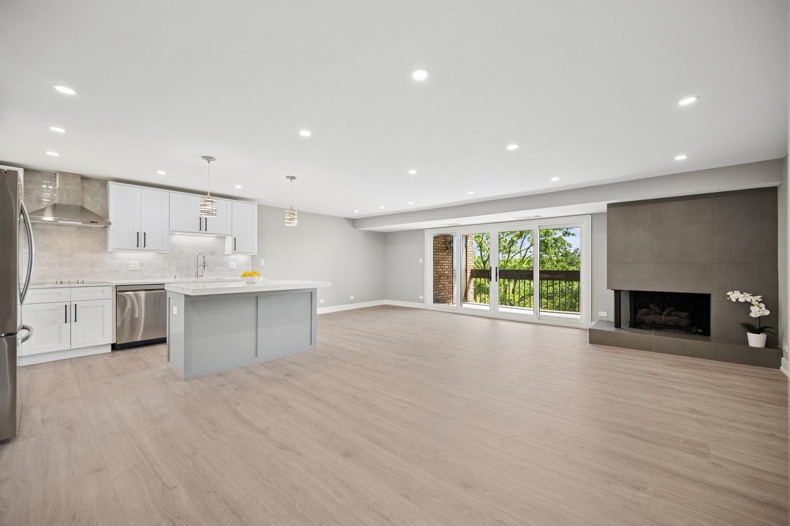 3851 Mission Hills Road, Unit 409 Northbrook, IL 60062 - Photo 3 of 19 a view of an empty room with a fireplace and a window