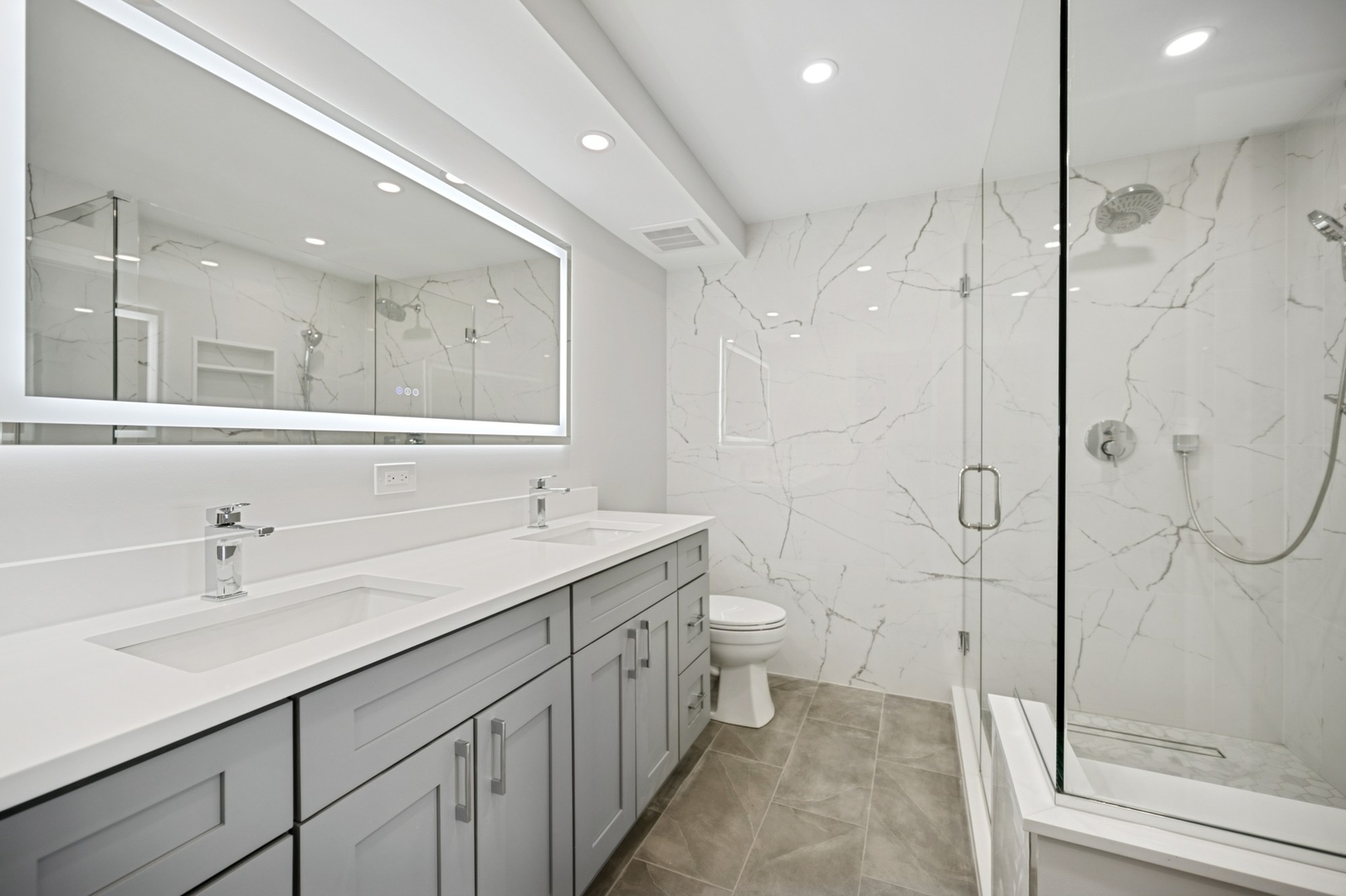 3851 Mission Hills Road, Unit 409 Northbrook, IL 60062 - Photo 10 of 19 a bathroom with a double vanity sink toilet and shower
