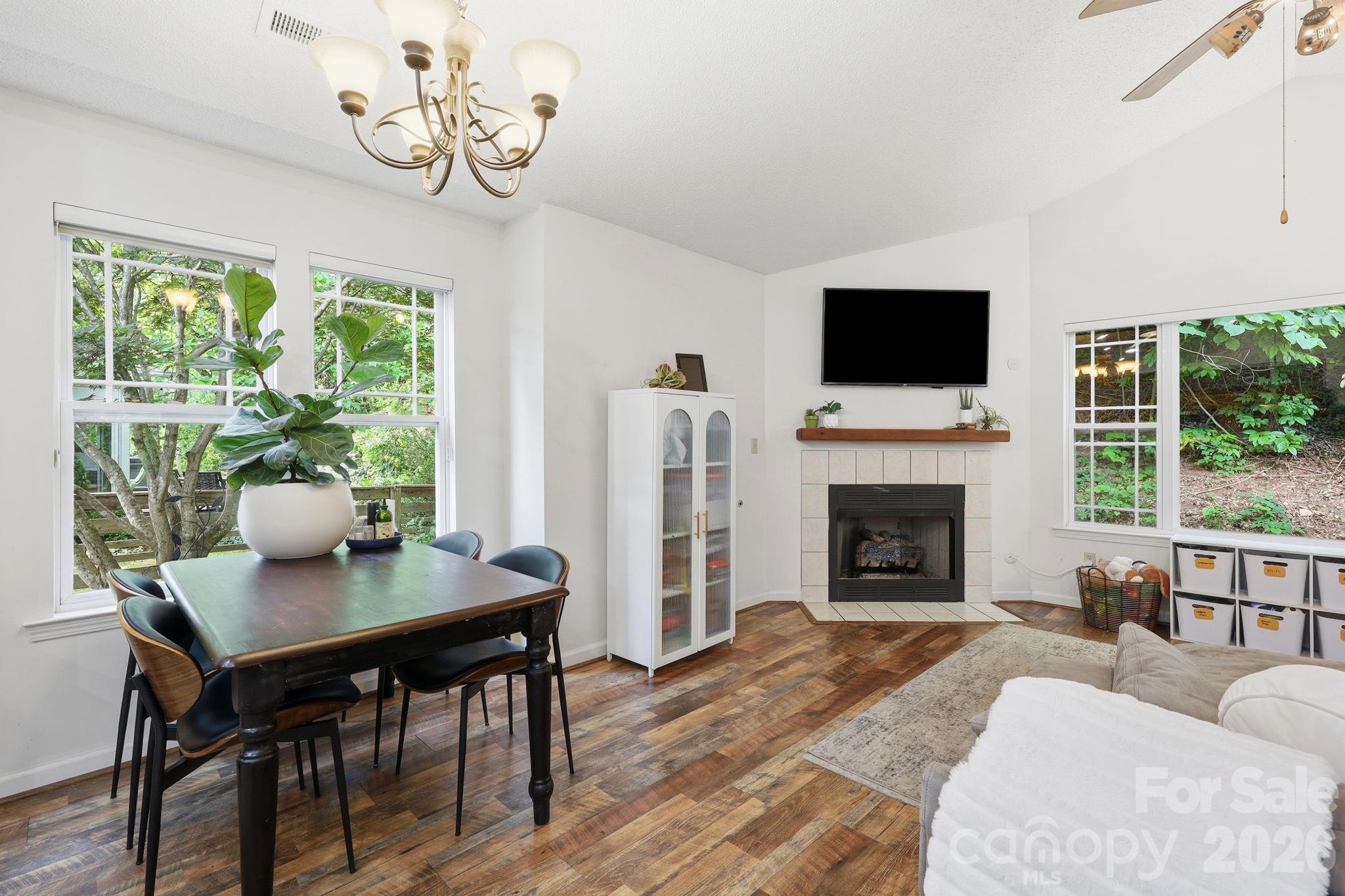 51 Sunview Circle Arden, NC 28704 - Photo 6 of 31 a living room with furniture a fireplace and a flat screen tv
