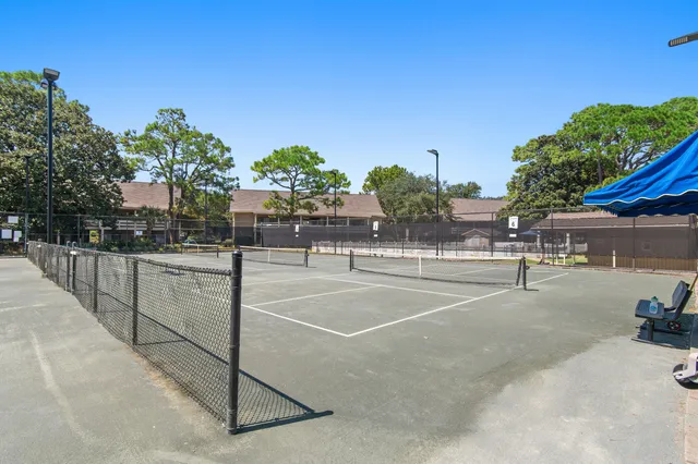 a front view of house with a garden