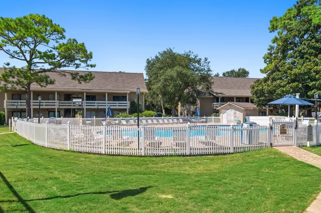 a view of swimming pool with a table and chairs
