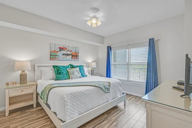 a bedroom with a bed and a desk