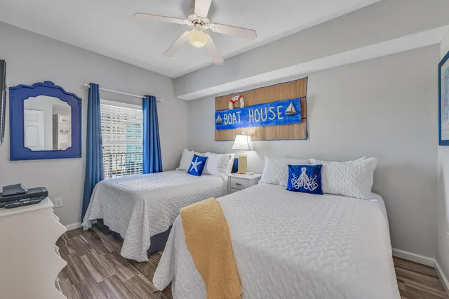 a bedroom with double bed and a window