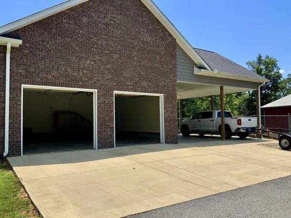 a view of a park with large trees