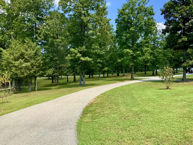 a view of a room with wooden floor and a window