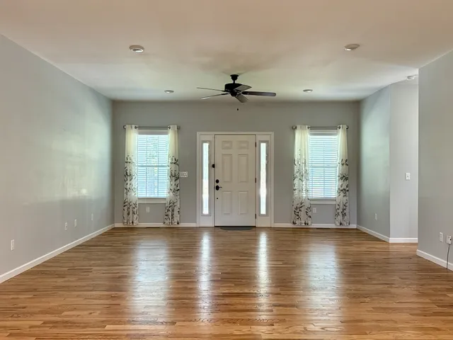 a white toilet sitting next to a shower