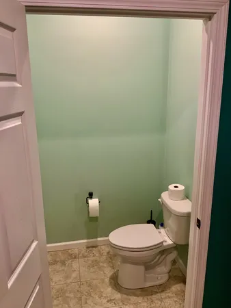 a spacious bathroom with a granite countertop sink and a mirror