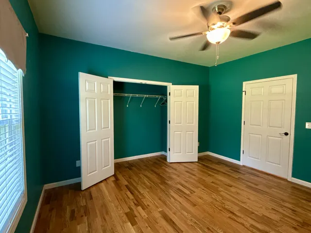a bathroom with a shower and a mirror