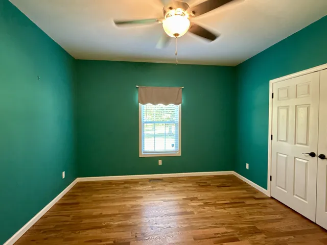 a kitchen with stainless steel appliances a stove a microwave and a sink