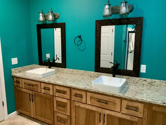 an empty room with wooden floor closet and ceiling fan