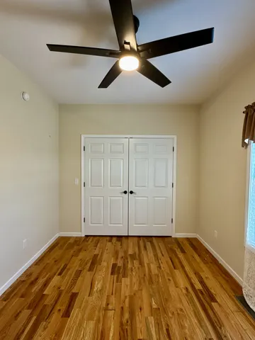 a room with a fireplace and a wooden floor