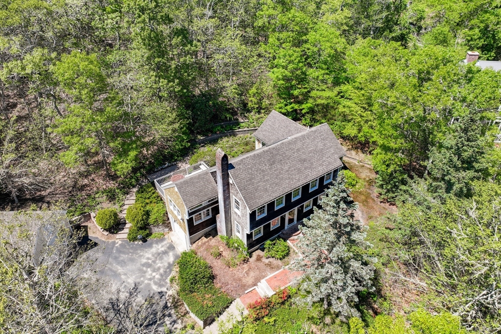 59 Valley Road Brewster, MA 02631 - Photo 1 of 42 an aerial view of a house with a yard and large trees