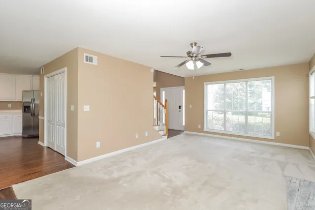 a view of an empty room with a window