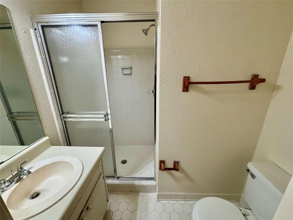 5296 Weyden Trail, Unit B Norcross, GA 30071 - Photo 19 of 25 a bathroom with a sink toilet and shower