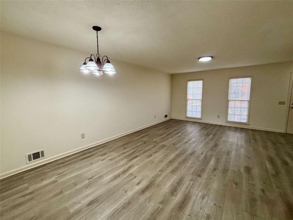 5296 Weyden Trail, Unit B Norcross, GA 30071 - Photo 5 of 25 a view of empty room with wooden floor