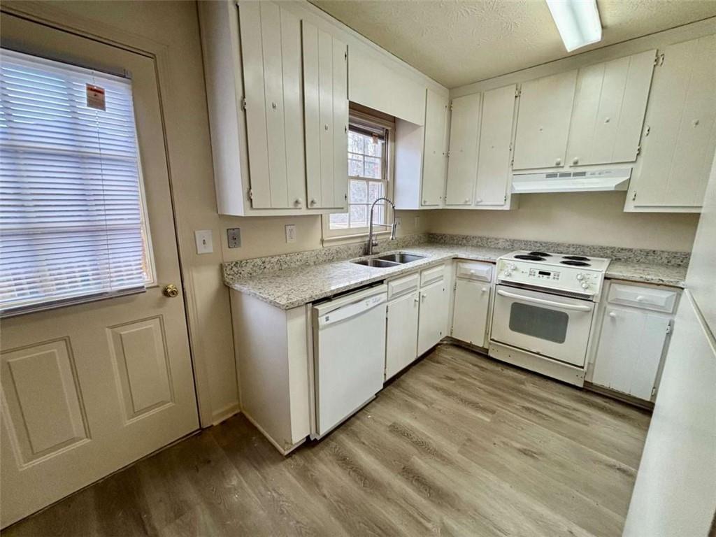 5296 Weyden Trail, Unit B Norcross, GA 30071 - Photo 7 of 25 a white kitchen with sink and cabinets