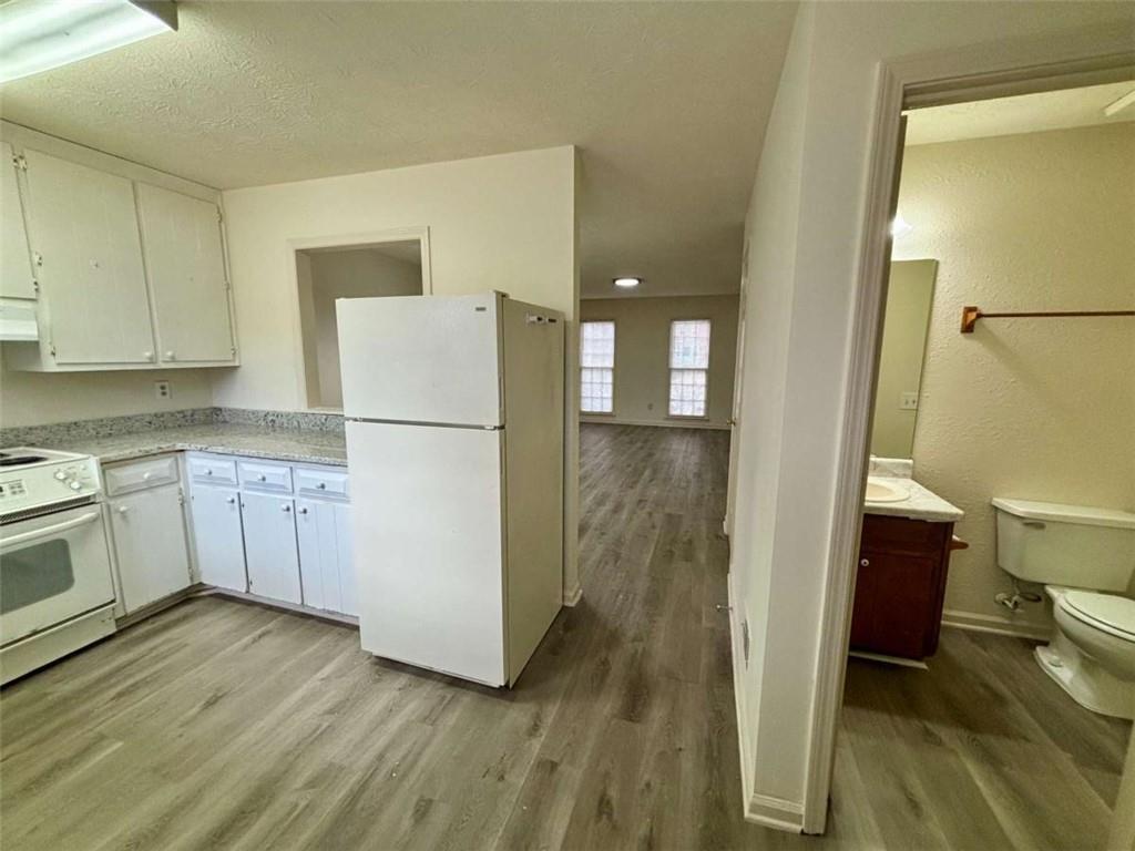 5296 Weyden Trail, Unit B Norcross, GA 30071 - Photo 8 of 25 a white refrigerator freezer sitting inside of a kitchen