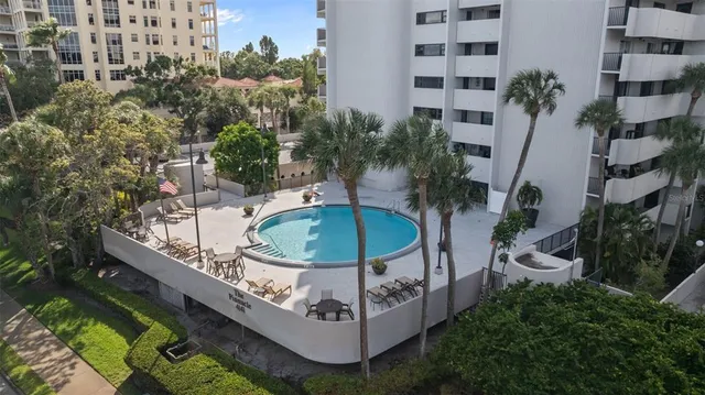 a view of a chairs and table in backyard