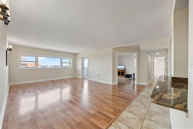 wooden floor in a empty room with a window