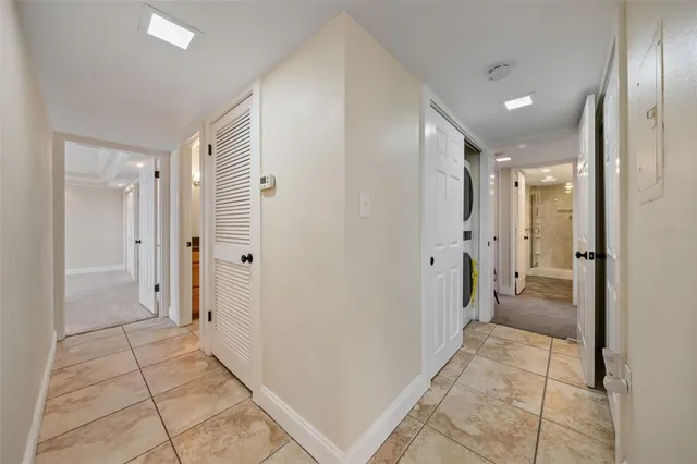 a bathroom with a shower and a glass door