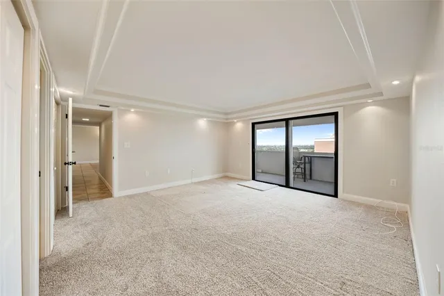 a bedroom with a large bed and a tv