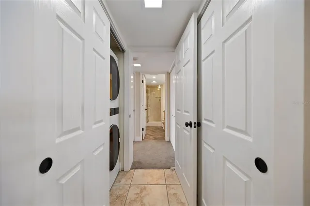 a view of a hallway with washer and dryer