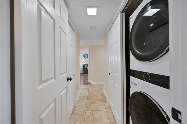 a view of a hallway with wooden shelves