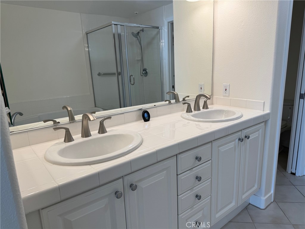 1400 East Ocean Boulevard, Unit 1203 Long Beach, CA 90802 - Photo 14 of 34 a bathroom with double sink and a mirror