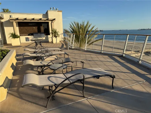 a view of a swimming pool with a lounge chair