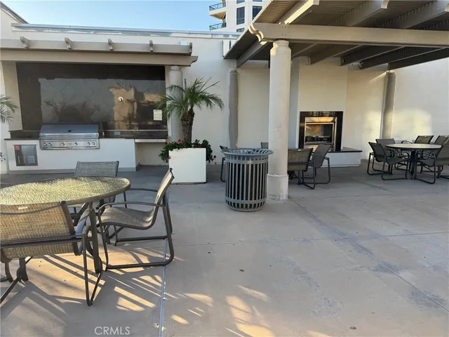a view of a patio with a table and chairs