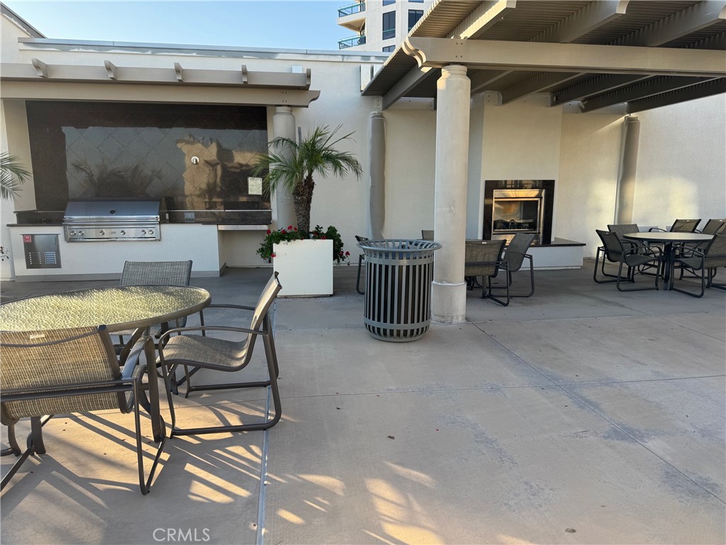 1400 East Ocean Boulevard, Unit 1203 Long Beach, CA 90802 - Photo 25 of 34 a view of a patio with a table and chairs