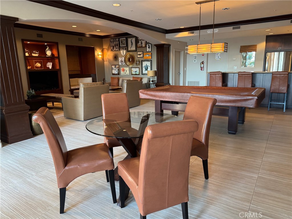 1400 East Ocean Boulevard, Unit 1203 Long Beach, CA 90802 - Photo 29 of 34 a view of a dining room with furniture and wooden floor