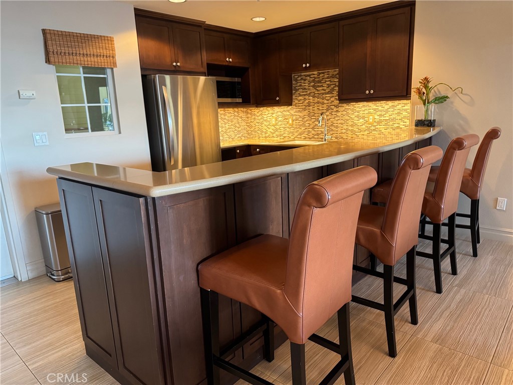 1400 East Ocean Boulevard, Unit 1203 Long Beach, CA 90802 - Photo 33 of 34 a view of a dining room with furniture and window