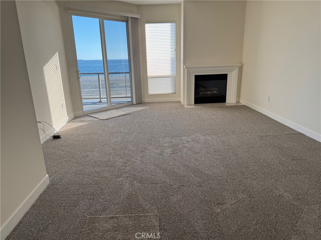 1400 East Ocean Boulevard, Unit 1203 Long Beach, CA 90802 - Photo 6 of 34 an empty room with windows and fireplace