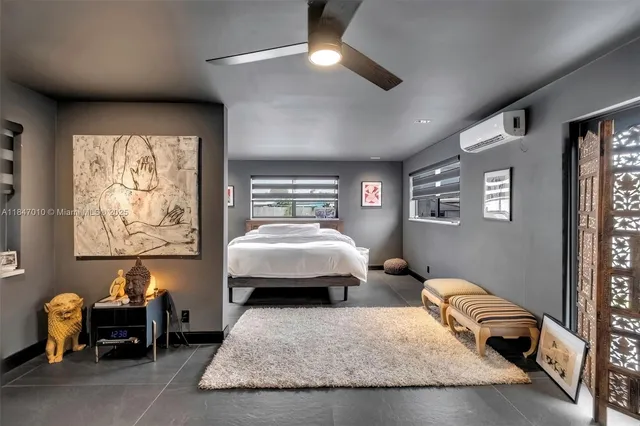 a bedroom with furniture and a window