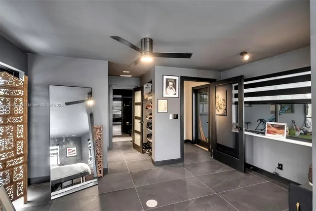 a open kitchen with stainless steel appliances kitchen island granite countertop a refrigerator and a sink