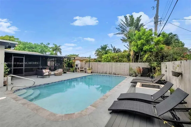 a view of a backyard with sitting area and furniture