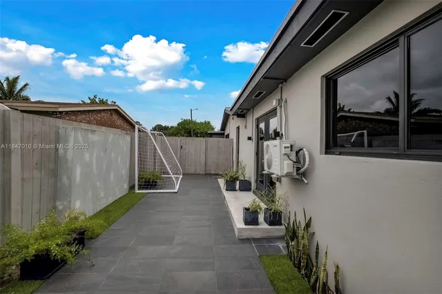 a view of a backyard with sitting area